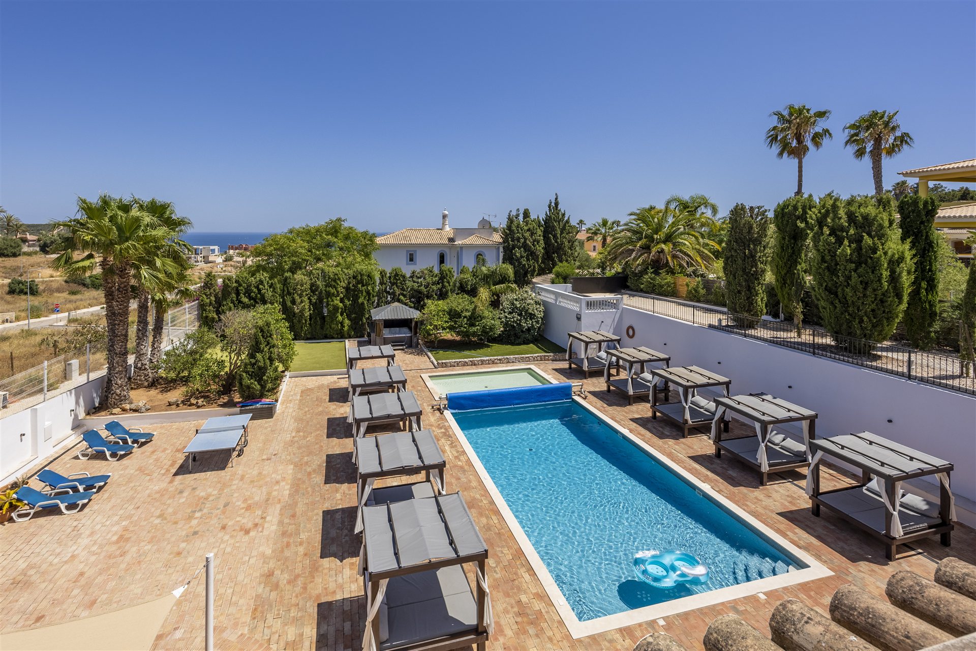 Elevated pool terrace with sea views