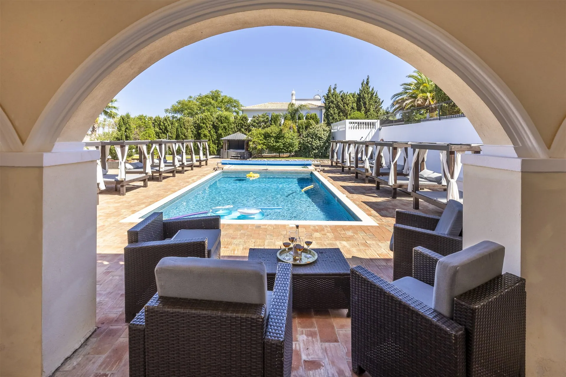 Villa Lux Luz pool through the archway