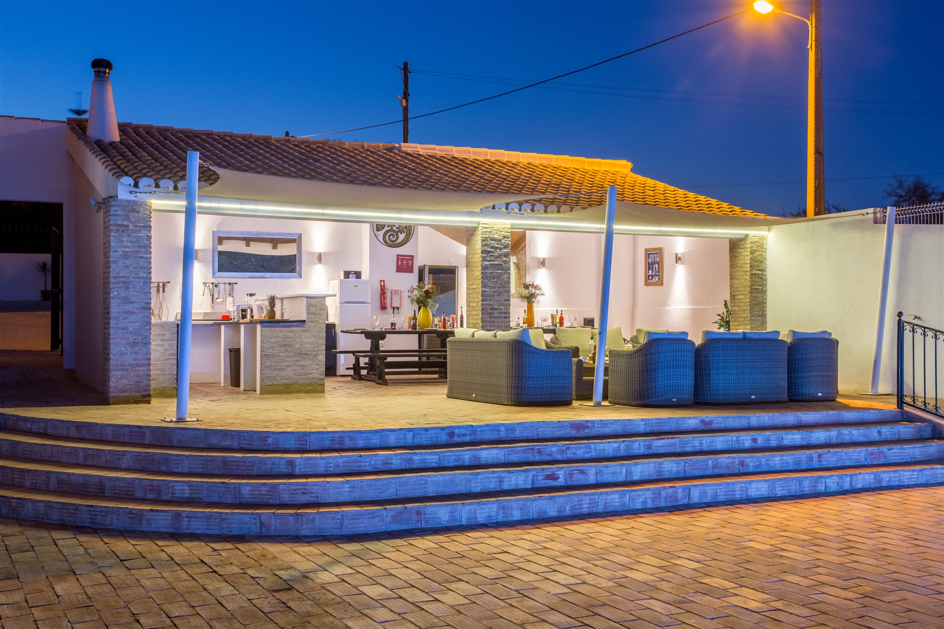 The terrace and outdoor lounge at dusk