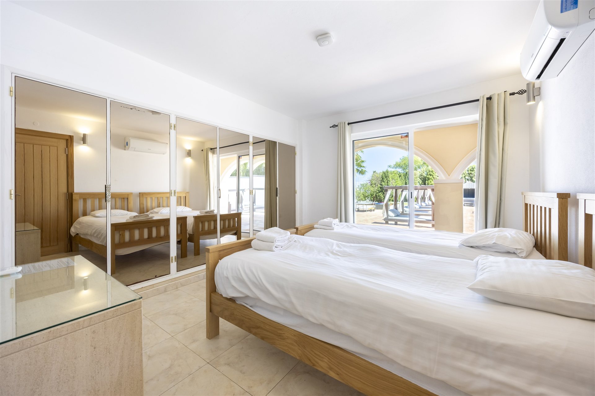 Bright twin bedroom with sea view