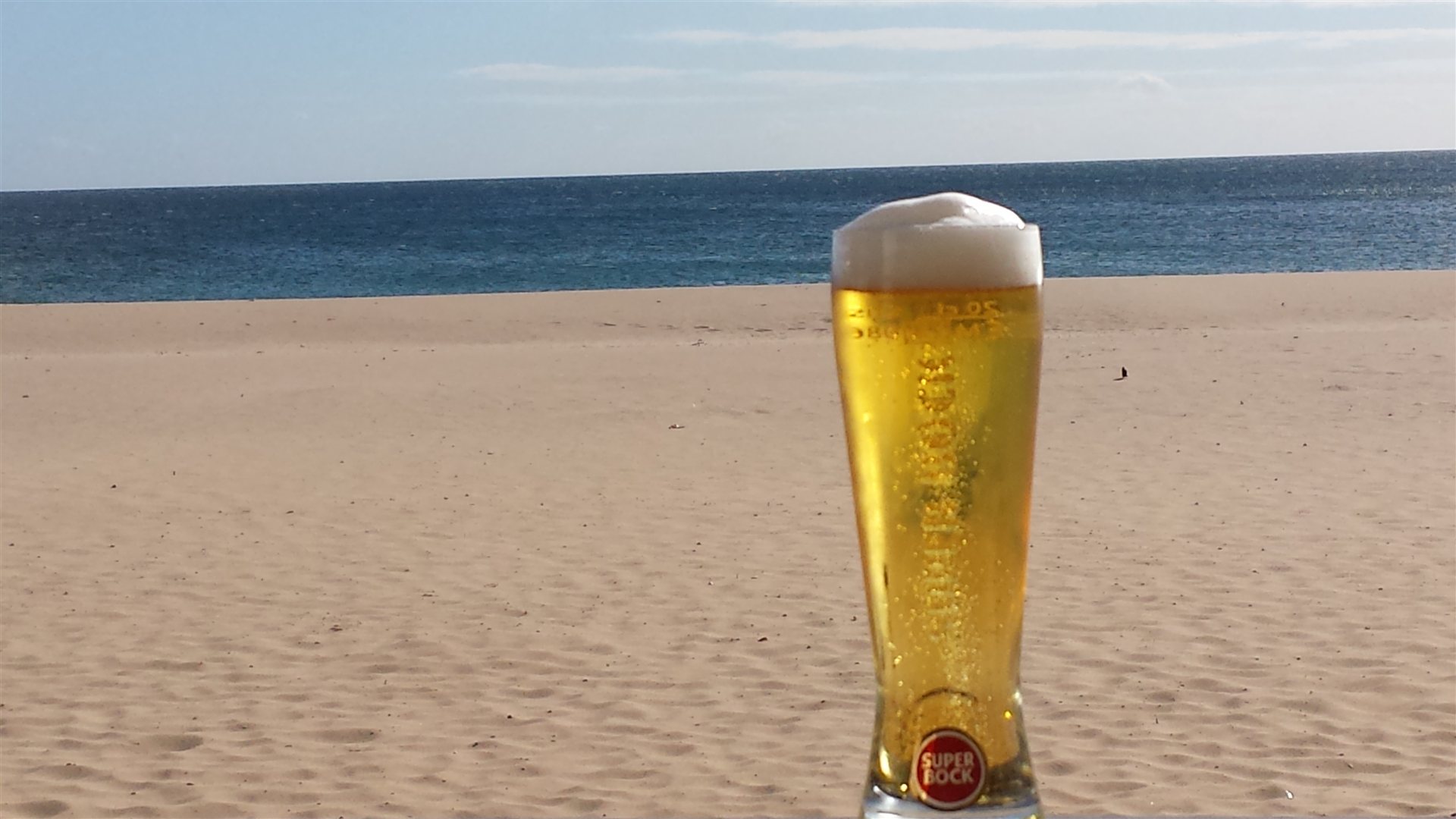 An ice cold beer on Praia da Luz beach