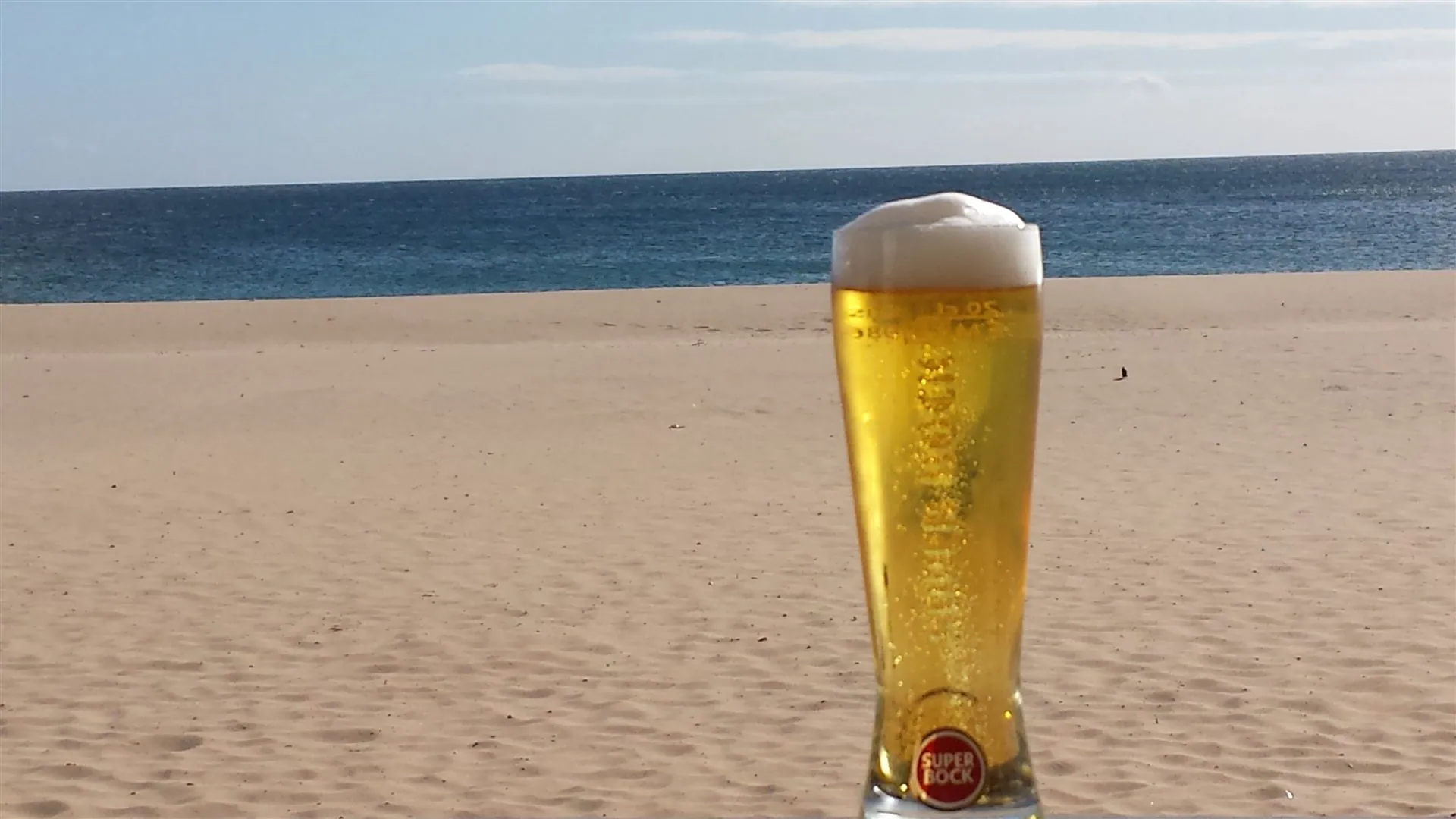 An ice cold beer on Praia da Luz beach